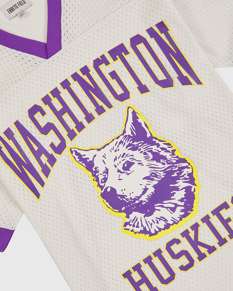 The Ebbets Field University of Washington Mesh Football Jersey is a white mesh jersey with purple trim, showcasing a bold purple and yellow husky graphic and prominent “University of Washington Huskies” text, honoring their storied Rose Bowl tradition.