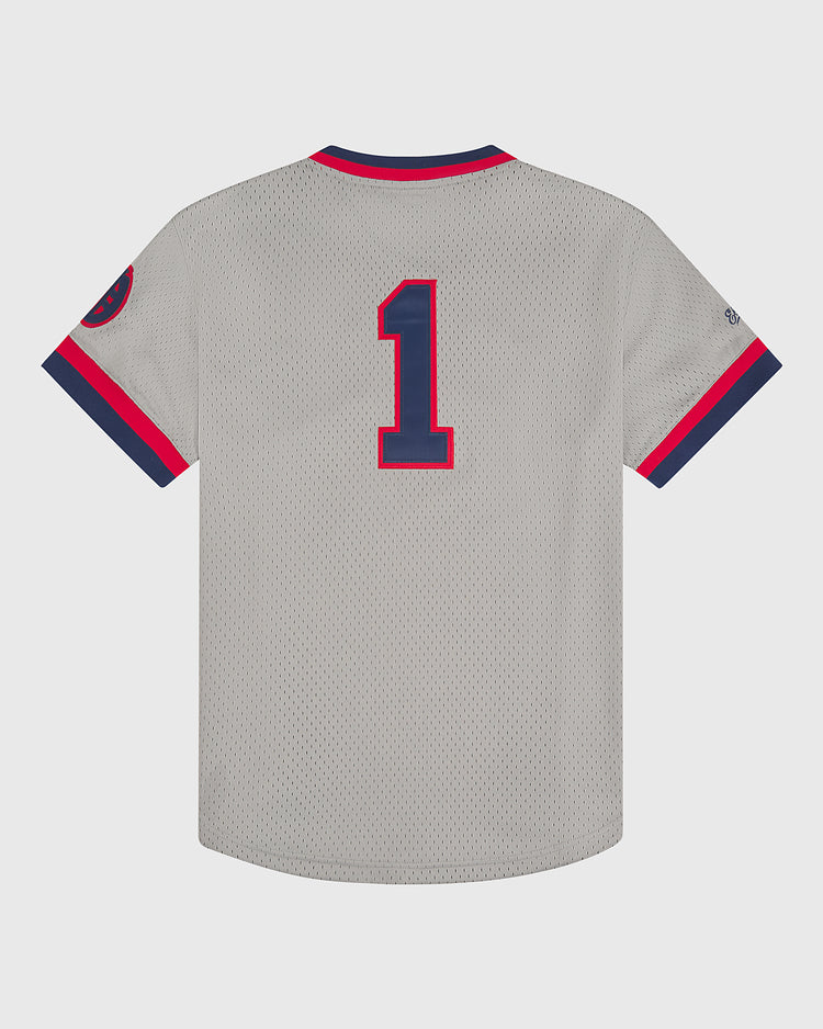The Ebbets Field Oakland Oaks 1948 Mesh V-Neck Road Jersey is a gray baseball jersey with dark blue and red trim, featuring a large number 1 on the back. The sleeves have dark blue and red stripes and a round patch on the left arm.