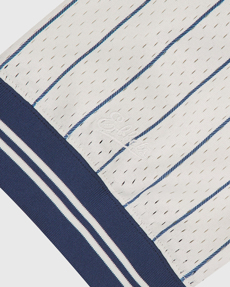 Close-up of the Ebbets Field San Francisco Seals 1933 Mesh V-Neck Home Jersey, showcasing its white mesh fabric with thin blue pinstripes and a thick navy ribbed hem accented by white and blue stripes. Subtle embroidery appears on the fabric near the hem.