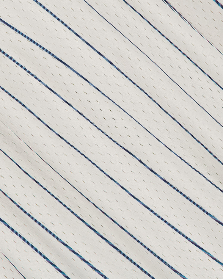The Ebbets Field San Francisco Seals 1933 Mesh V-Neck Home Jersey features a white fabric with thin blue diagonal stripes and rows of small perforated holes, giving it a lightweight and breathable design reminiscent of classic sportswear.
