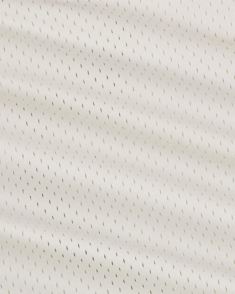 Close-up of the Ebbets Field Hollywood Stars 1940 Mesh V-Neck Home Jersey, showcasing light-colored mesh fabric with small, evenly spaced perforations that create a subtle diagonal pattern across the material.