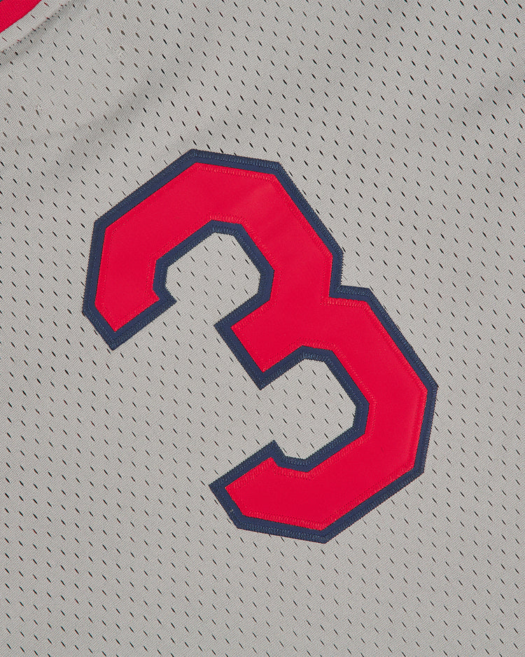 A close-up of the Seattle Rainiers 1951 Mesh V-Neck Road Jersey by Ebbets Field, featuring a gray mesh fabric with small holes for breathability and a prominent red number 3 outlined in blue.