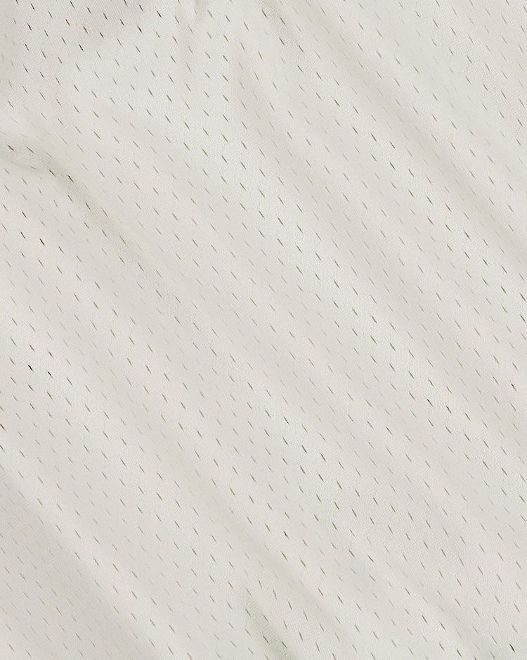 Close-up of the Salt Lake City Bees 1959 Mesh V-Neck Home Jersey by Ebbets Field, featuring white mesh fabric with small, evenly spaced holes and a textured, slightly wrinkled surface—evoking the look of a classic vintage baseball jersey.