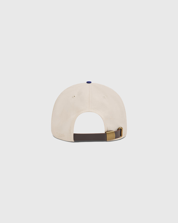 The Hollywood Stars 1957 Cotton Twill Ballcap by Ebbets Field is pictured from the back, displaying its beige cotton twill construction and a dark brown adjustable strap with a brass buckle, set against a plain white background—a timeless design inspired by classic Gilmore Field and the legendary 1957 Hollywood Stars.