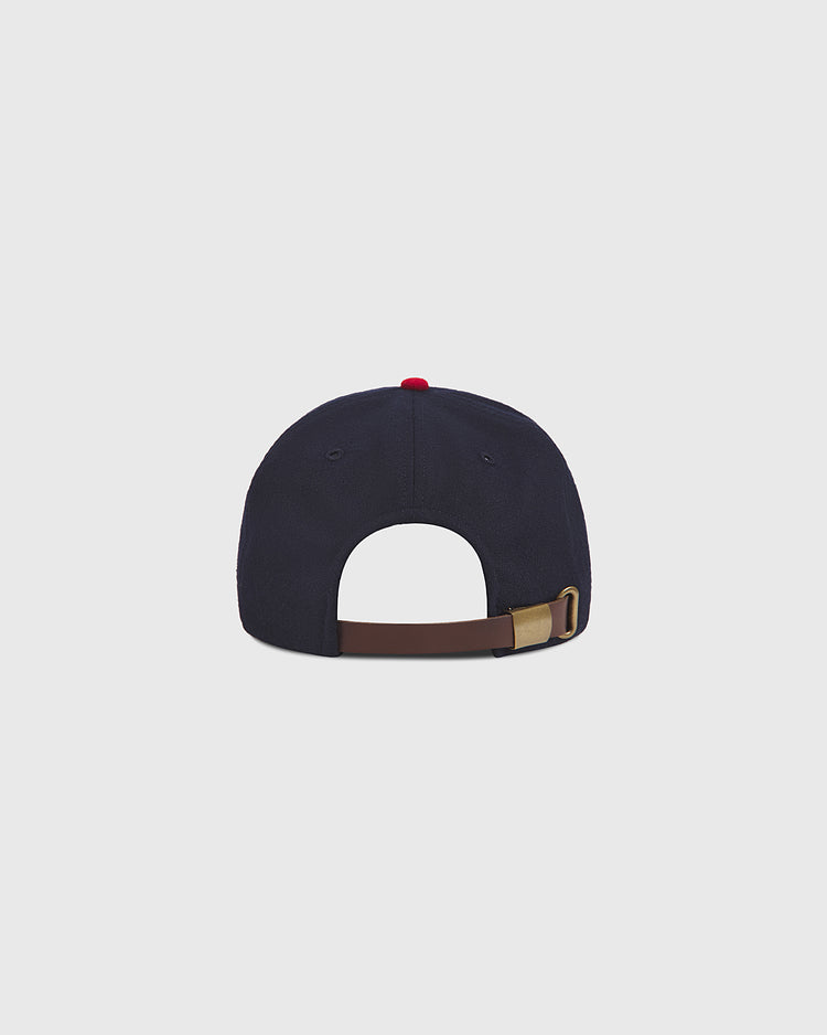 The Oakland Oaks 1948 Authentic Wool Ballcap by Ebbets Field is displayed from the back, showcasing a brown adjustable strap with a brass buckle and a small red button on top, set against a plain light gray background.