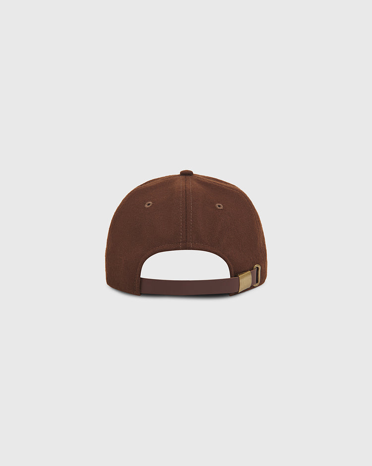 An Ebbets Field San Francisco Seals 1940 Wool Ballcap is shown from the back, highlighting its brown vintage design with an adjustable strap featuring a metal buckle and stitched eyelets on each side. Inspired by classic styles, this cap is displayed against a plain light gray background.
