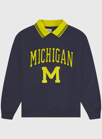The Ebbets Field University of Michigan Collared Crewneck is a navy blue long-sleeve sweatshirt featuring a yellow-striped collar and a bold yellow MICHIGAN M on the front.