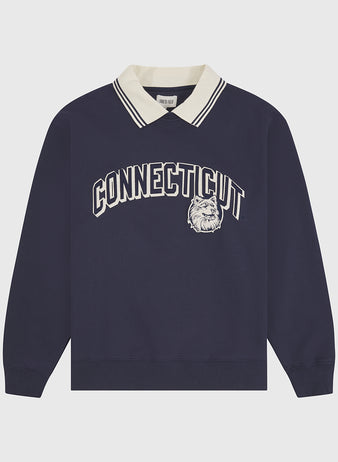 The University of Connecticut Collared Crewneck by Ebbets Field features a navy blue long-sleeve design with a cream collar, bold white “CONNECTICUT” lettering, and a bulldog graphic on the front.