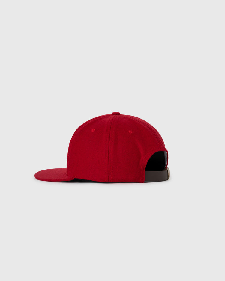 A red San Juan Senadores 1947 Authentic Wool Ballcap by Ebbets Field Flannels is shown from the back, highlighting its adjustable black strap and flat brim against a plain light gray background.
