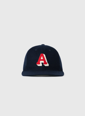 The EFF Atlanta Crackers 1939 Authentic Wool Ballcap features a navy blue design with a bold, red letter A outlined in white on the front, inspired by vintage baseball caps, shown against a plain light gray background.