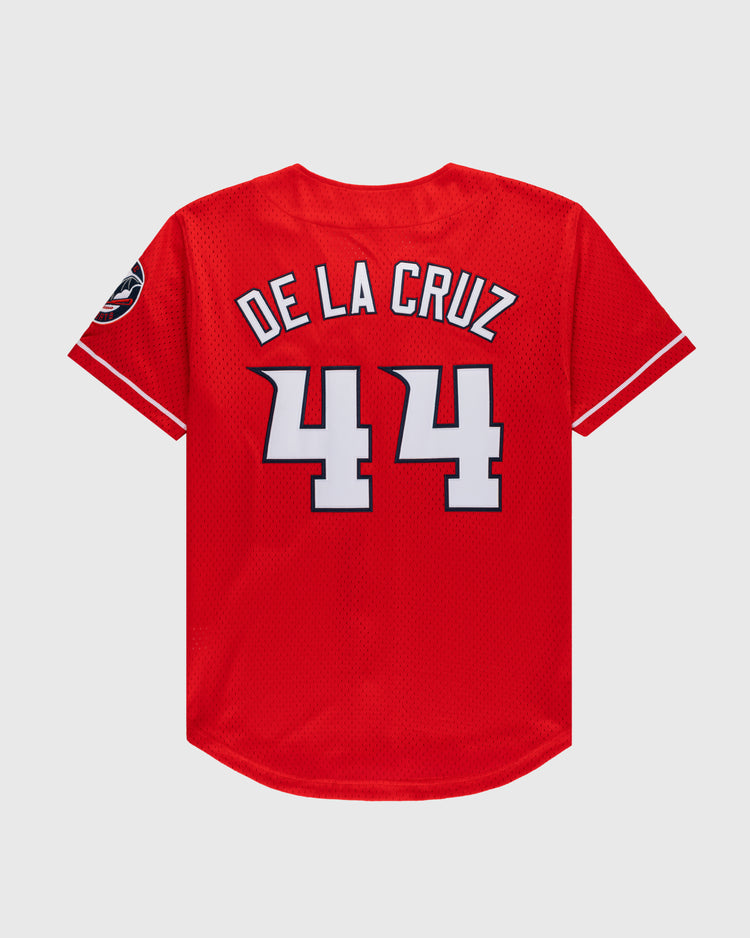 The Ebbets Field Elly De La Cruz Button Up Mesh Jersey in red features white and black trim, DE LA CRUZ and number 44 in large white letters on the back, plus a visible left sleeve patch.