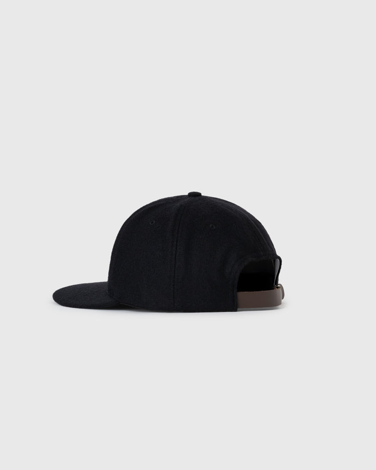 The EFF Tokyo Kyojin (Giants) City Series Wool Ballcap is shown in black from the back and side, with a curved brim and adjustable brown strap, set against a plain light gray background.
