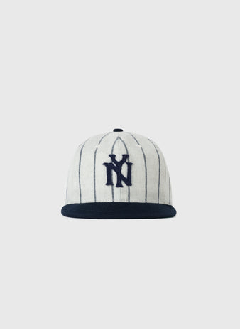 The EFF Bronx Giants 1922 Authentic Wool Soft Short Brim Ballcap is white with thin navy pinstripes, a navy brim, and a large navy NY logo embroidered on the front, shown against a plain white background.