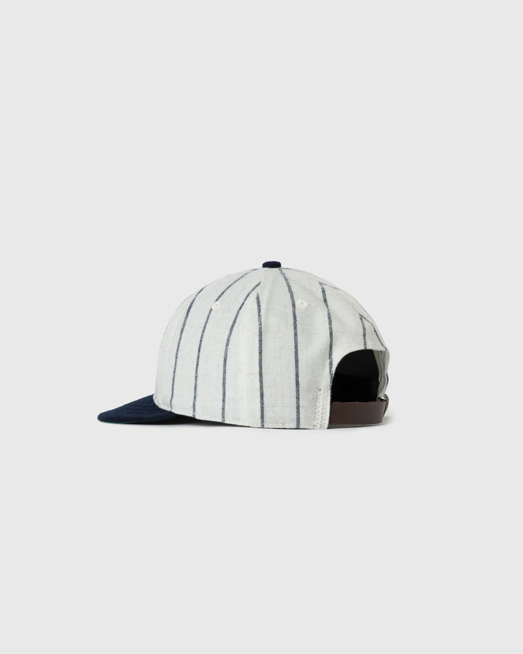 The EFF Bronx Giants 1922 Authentic Wool Soft Short Brim Ballcap features a white crown with thin navy stripes, a navy brim, and an adjustable brown strap, displayed on a light gray background.