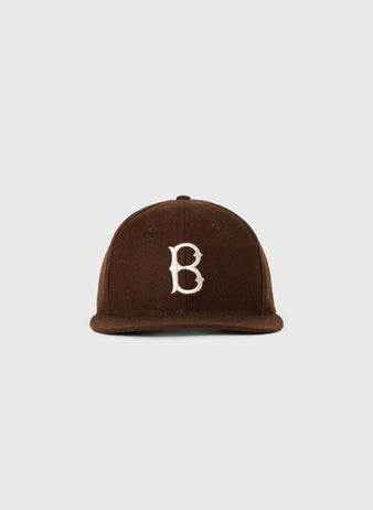The EFF Brown University 1959 Authentic Wool Ballcap features a brown design with a curved brim and white embroidered B on the front, shown against a plain light gray background.
