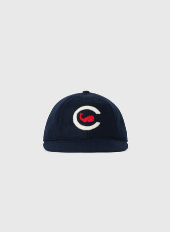 The EFF Chicago Whales 1915 Authentic 8-Panel Soft Short Brim Ballcap is a navy vintage wool cap with a white C and red design on the front, shown against a light gray background.