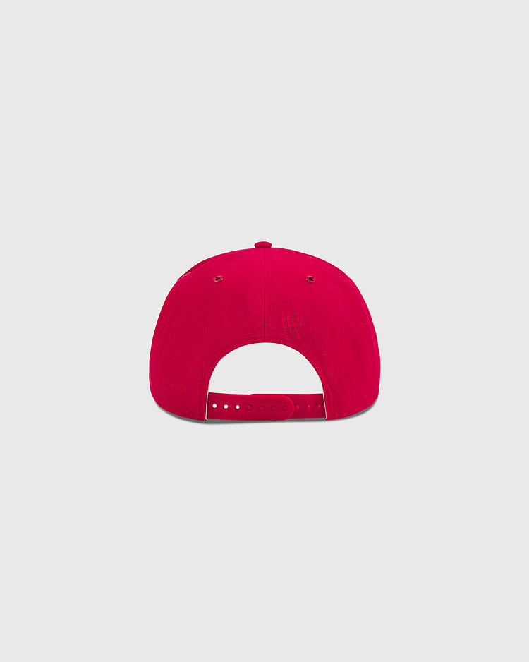 The Ebbets Field Aloha 100th Infantry 1942 A-Frame Cotton Twill Ballcap in red, shown from the back with an adjustable snap closure and dual ventilation eyelets on each side, set against a plain light gray background.