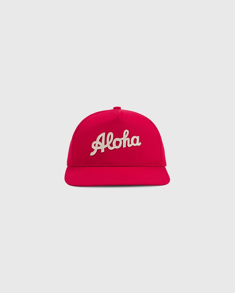 The Ebbets Field Aloha 100th Infantry 1942 A-Frame Cotton Twill Ballcap in bright pink features “Aloha” embroidered in white cursive on the front, shown against a plain light gray background.