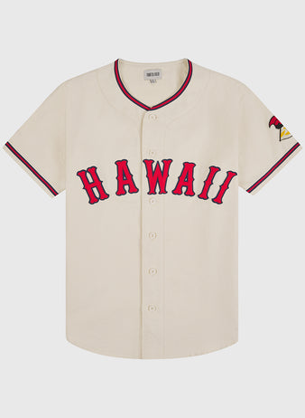 The Ebbets Field Hawaii Islanders (PCL) 1964 Cotton Twill Baseball Jersey is cream-colored with bold red “HAWAII,” red and black sleeve trim, a Pacific Coast League patch, and the number 24 on the left sleeve.