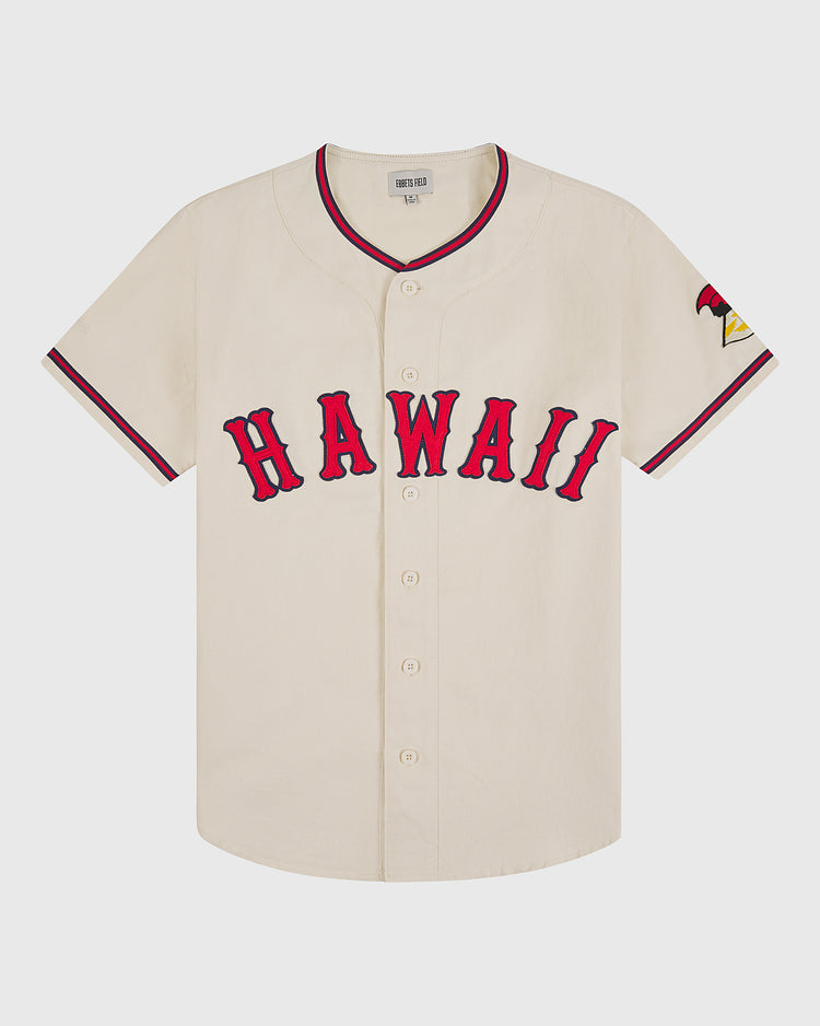 The Ebbets Field Hawaii Islanders (PCL) 1964 Cotton Twill Baseball Jersey is cream-colored with bold red “HAWAII,” red and black sleeve trim, a Pacific Coast League patch, and the number 24 on the left sleeve.