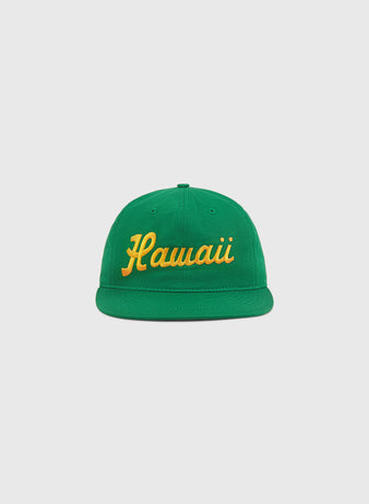 The Ebbets Field Hawaii Islanders (PCL) 1961 Logo Script Cotton Twill Ballcap features “Hawaii” in yellow cursive on green cotton twill, shown against a plain white background.