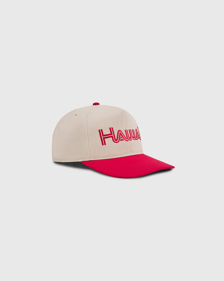 The Ebbets Field Hawaii Islanders 1965 Logo A-Frame Cotton Twill Ballcap features a beige retro design with a red brim, red top button, and HAWAII embroidered in red. Inspired by the original Hawaii Islanders hat. Shown on a plain light gray background.