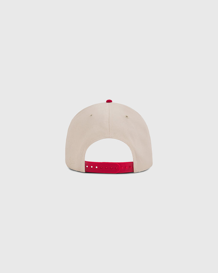 The Ebbets Field Hawaii Islanders 1965 Logo A-Frame Cotton Twill Ballcap in beige is shown from the back with a red retro snapback strap and red top button, displayed against a plain light gray background.