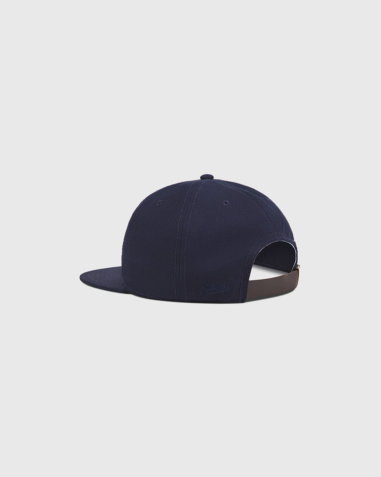 The University of Hawaii Rainbow Warriors Cotton Twill Ballcap by Ebbets Field is shown from the back, highlighting its adjustable strap and slightly curved brim, set against a plain light gray background.