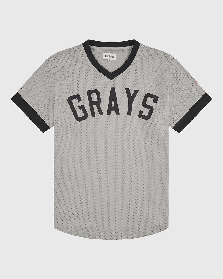 The Ebbets Field Homestead Grays V-Neck Mesh Jersey showcases a timeless gray design with black trim on the collar and sleeves, featuring GRAYS in bold black lettering across the chest as an homage to the iconic jerseys worn by the legendary Negro Leagues team.