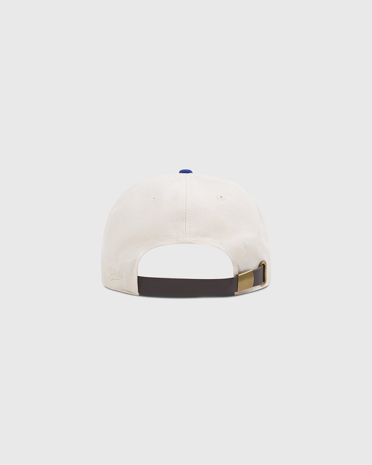 A rear view of the Ebbets Field Brooklyn Royal Giants Cotton Twill Ballcap, crafted in white cotton twill and featuring an adjustable dark strap with a metal clasp. The design subtly honors Black baseball history and the legendary Brooklyn Royal Giants, set against a plain, light-colored background.