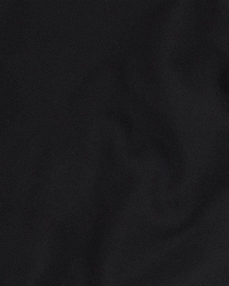A deep black surface with delicate, understated swirls—evoking the premium all-wool material of the Tokyo Giants All-Wool Varsity Jacket by Ebbets Field, inspired by Japan’s iconic professional baseball team.