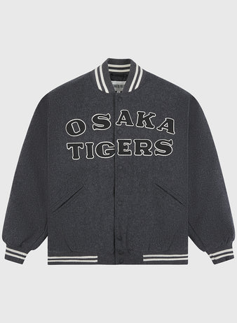 An essential piece of Japanese baseball memorabilia, the Osaka Tigers All-Wool Varsity Jacket by Ebbets Field features a dark gray design with white striped cuffs and collar, and bold white OSAKA TIGERS lettering across the front.