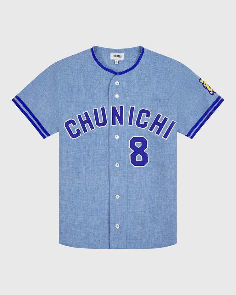 The Ebbets Field Chunichi Dragons 1969 Authentic Wool Road Jersey features a light blue vintage design with “CHUNICHI” and the number 8 boldly displayed in blue on the front, inspired by the legendary 1969 Chunichi Dragons jersey. Blue trim highlights the collar and sleeves, a colorful patch details the right sleeve, and classic white buttons run down the center, faithfully recreating all the authentic features of a true wool baseball jersey.