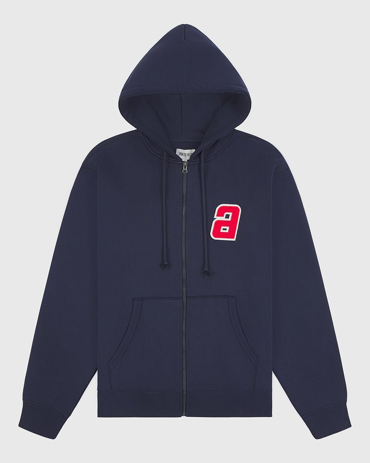 The Ebbets Field Sankei Atoms Heavyweight Cotton Terry Full-Zip Hoodie features a navy blue design with a hood, front pockets, and a red and white number 9 patch on the left chest. Inspired by vintage-style hoodies, its simple and casual look makes it perfect for everyday wear.