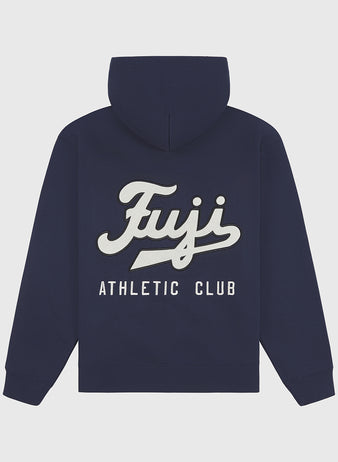 The Fuji Athletic Club Heavyweight Cotton Terry Full-Zip Hoodie by Ebbets Field is a navy blue, vintage-inspired piece featuring “Fuji Athletic Club” in bold white and cream lettering across the back, paying homage to Japanese American baseball heritage. This hoodie includes a front pocket and a cozy hood for added comfort.