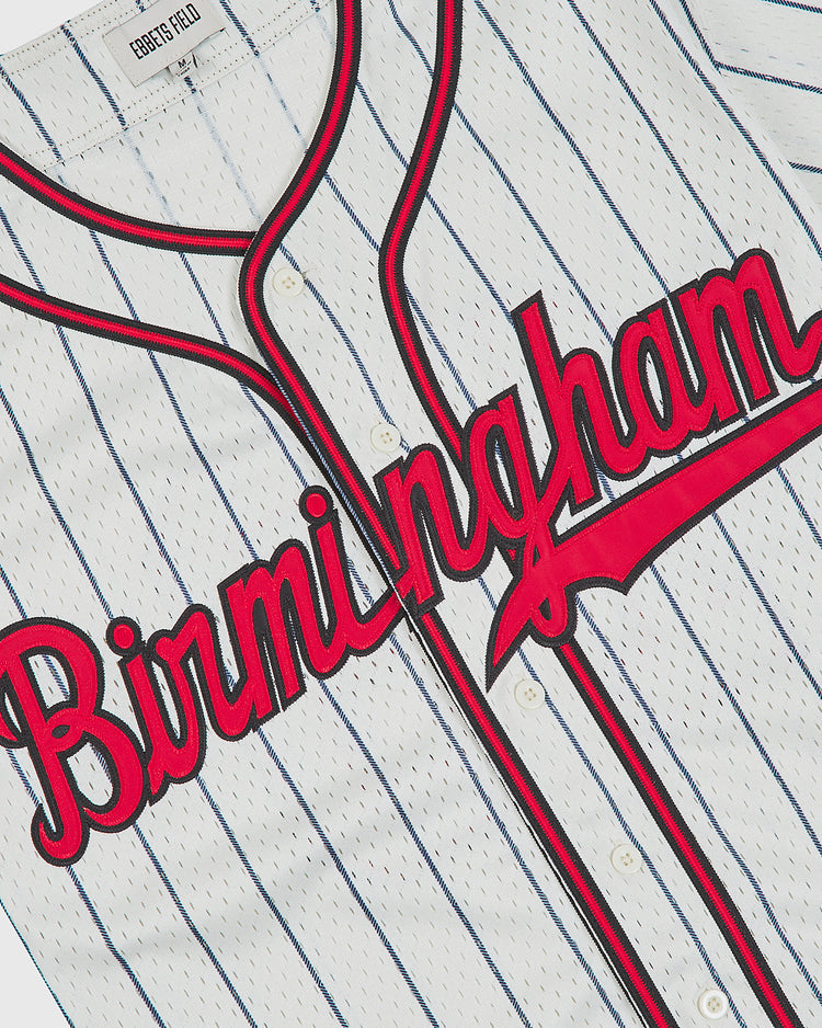 Ebbets Field Birmingham Black Barons 1945 Button-Up Mesh Home Jersey in white mesh with thin blue pinstripes, featuring red script lettering across the front and red-and-black trim along the button placket and collar.