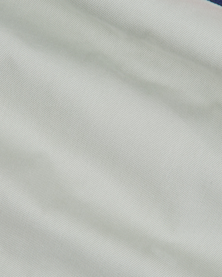 Light gray cotton twill fabric of a Kansas City Monarchs 1936 Road Jersey Cotton Twill with a visible diagonal weave.
