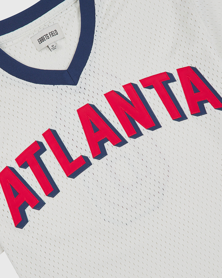 Atlanta Black Crackers 1940 V-Neck Mesh Jersey by Ebbets Field, featuring a white mesh V-neck with a dark blue collar and the word ATLANTA in red letters with blue shadowing across the chest.
