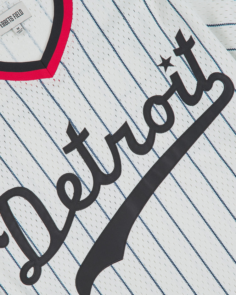 Ebbets Field Detroit Stars 1950 V-Neck Mesh Jersey in white mesh with blue pinstripes, featuring the word Detroit in dark script across the chest and a red-trimmed V-neck collar.