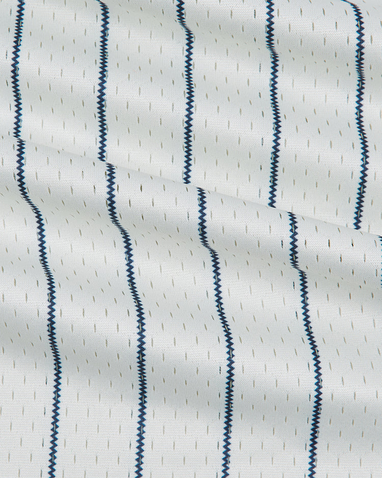 White mesh Detroit Stars 1950 V-Neck Mesh Jersey fabric featuring thin, vertical dark blue zigzag pinstripes.