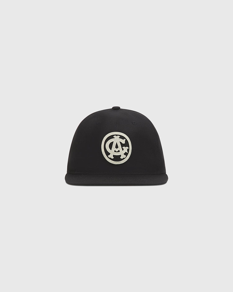 The Chicago American Giants 1927 Cotton Twill Ballcap by Ebbets Field is a black flat-brim cap with a white embroidered circular logo, shown on a plain light gray background.