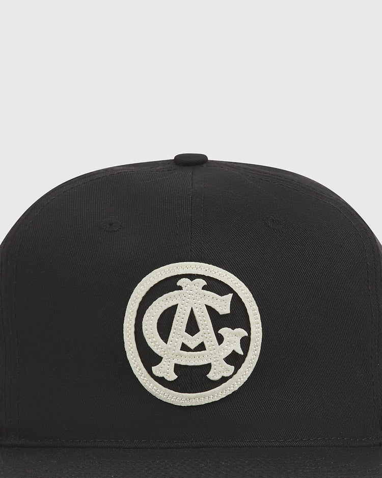 The Chicago American Giants 1927 Cotton Twill Ballcap by Ebbets Field is a black cap with a white embroidered circular patch featuring overlapping C, A, and T letters on the front.