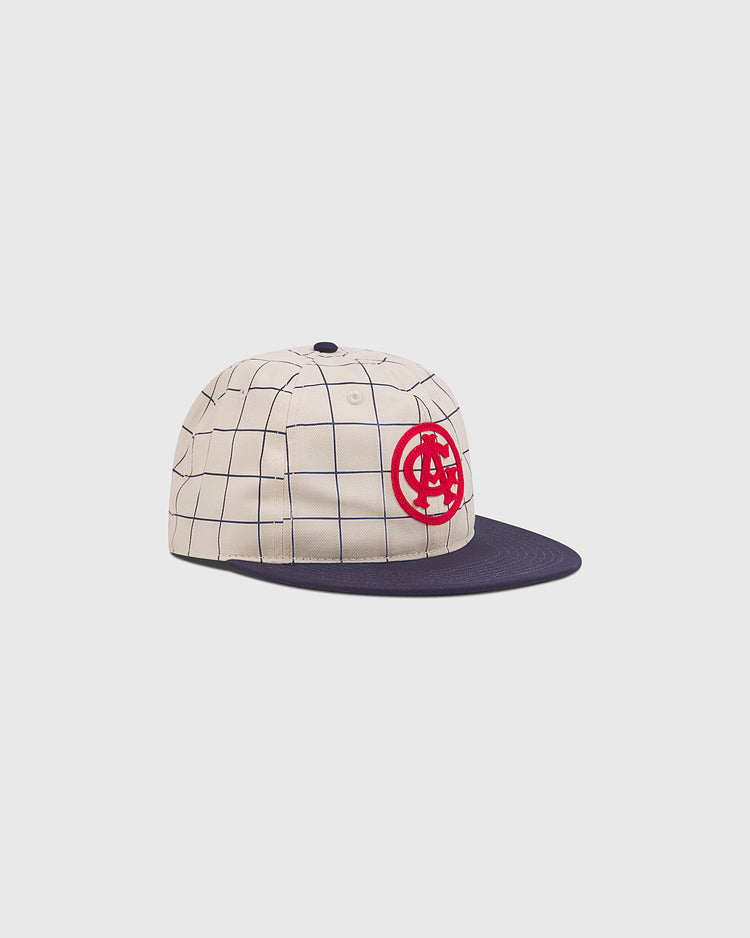 The Chicago American Giants 1919 Cotton Twill Ballcap by Ebbets Field features a beige crown with a navy blue grid, navy flat brim, and red embroidered circular logo, shown on a plain white background.