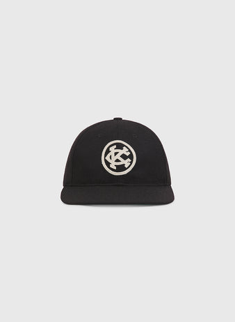 Ebbets Field Kansas City Monarchs 1924 Authentic Wool Ballcap, a black wool baseball cap with an off-white circular patch featuring an interlocking KC logo on the front.