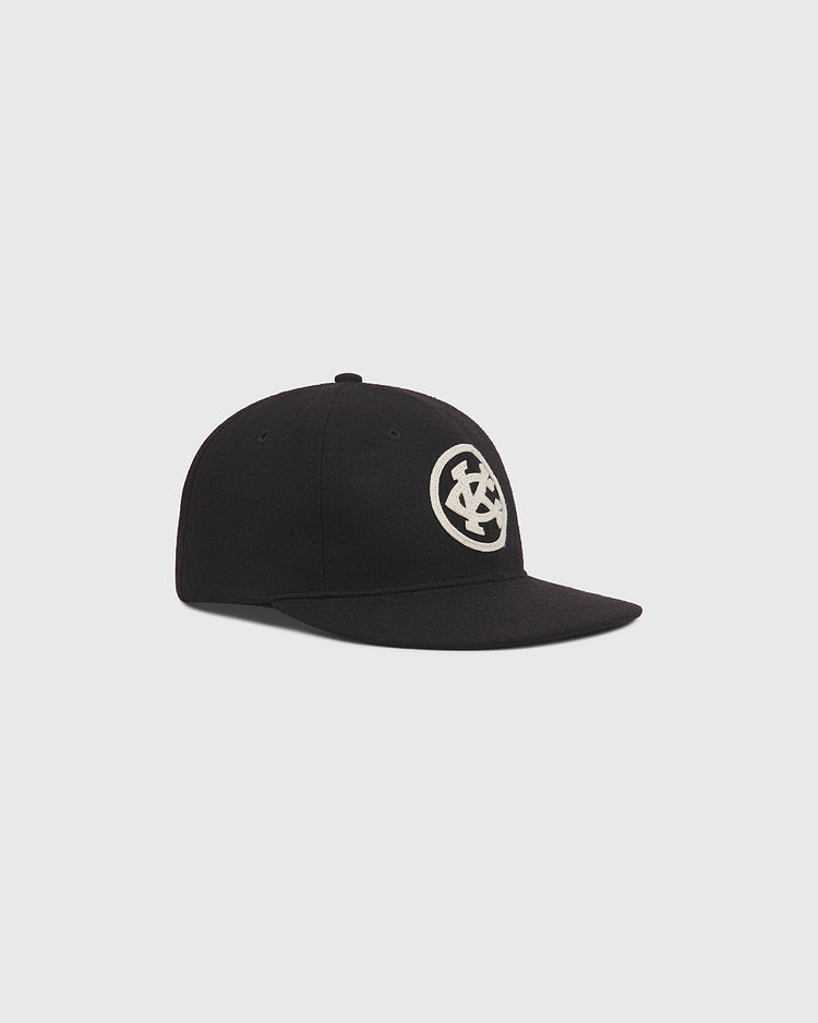 Ebbets Field Kansas City Monarchs 1924 Authentic Wool Ballcap in black wool with a cream-colored circular logo featuring the letters KC on the front.