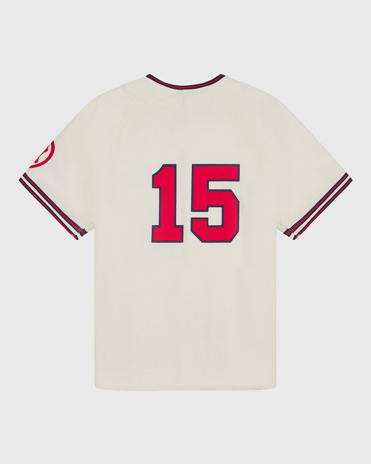 A cream-colored Taiyo Whales 1963 Authentic Wool Home Jersey by Ebbets Field, featuring authentic wool construction, red and black trim on the sleeves and neck, a striking red number 15 on the back, and a circular red patch on the left sleeve—faithfully capturing the vintage style of classic Japanese baseball jerseys.