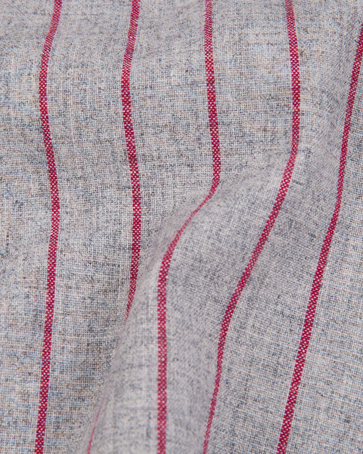 Ebbets Field’s Nagoya Club 1938 Authentic Wool Road Jersey features gray woven wool with vertical red stripes, a slightly wrinkled, textured finish that recalls the classic look of original jerseys from the 1938 era.