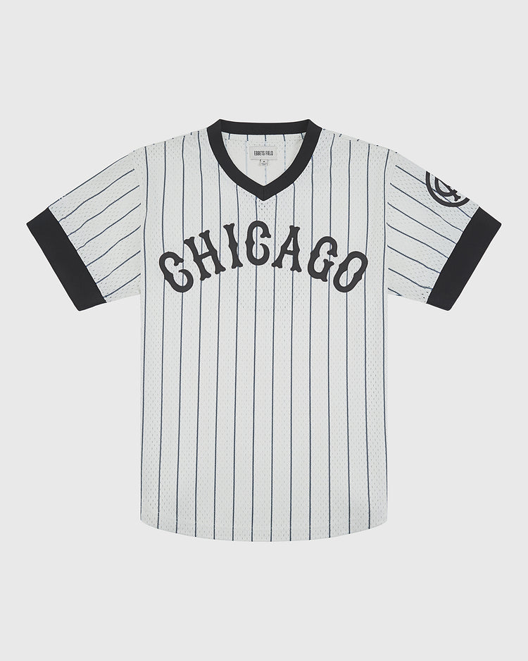 Ebbets Field Chicago American Giants 1927 V-Neck Mesh Jersey in white with pinstripes, black trim, a circular team logo on the left sleeve, and CHICAGO across the chest.