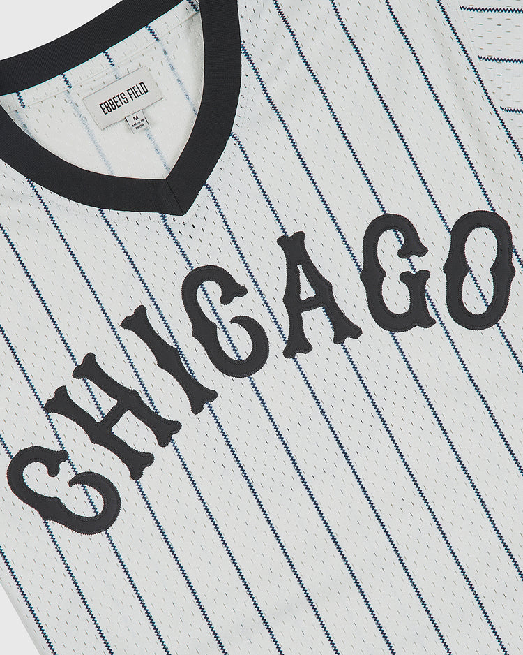 Chicago American Giants 1927 V-Neck Mesh Jersey in white mesh with black pinstripes and the word CHICAGO in black arched lettering across the chest.