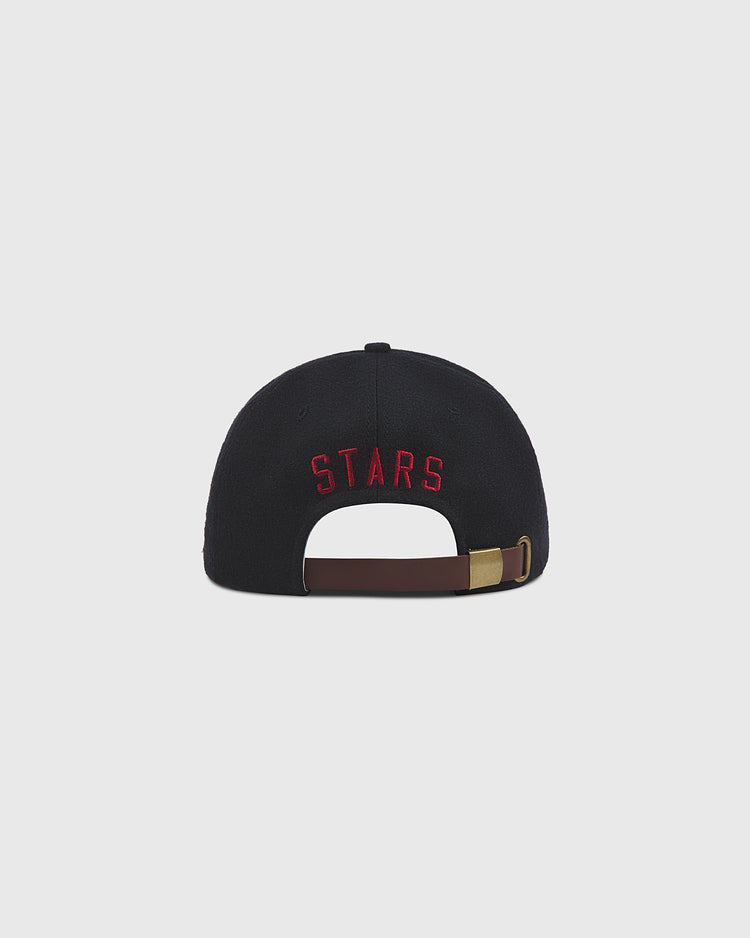 Back view of a Nashville Stars Authentic Wool Ballcap featuring STARS embroidered in red above an adjustable brown leather strap with a brass buckle.